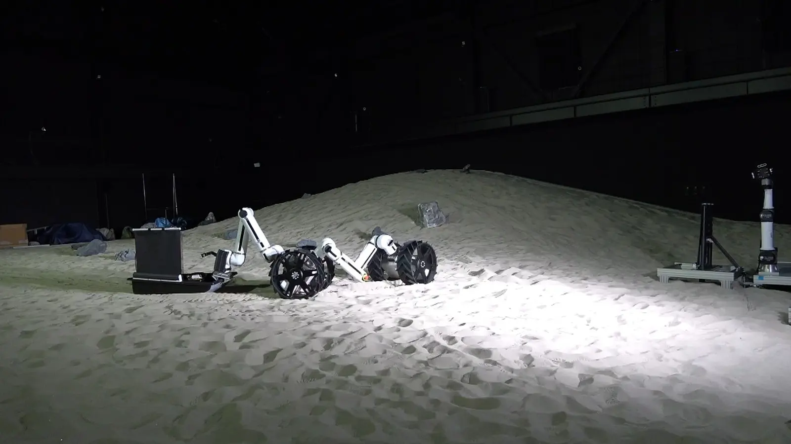 A Dragon towing a sledge carrying a folded solar tower, JAXA Space Exploration Test Field.