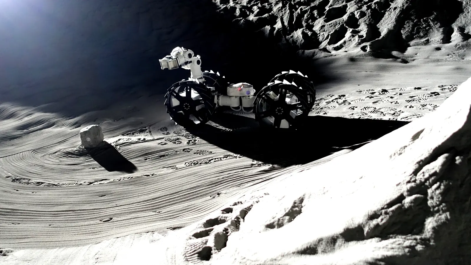 MoonBot in Dragon configuration on a crater rim in regolith simulant, DLR-ESA LUNA facility, Cologne.