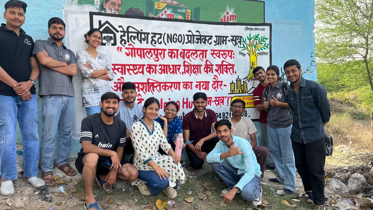 Volunteers at the GramSutr wall mural in Gopalpura, March 2026.