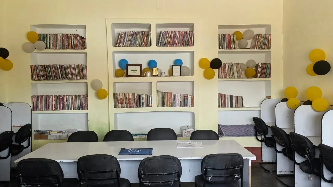 The GyanKutir reading room, shelved with donated books.